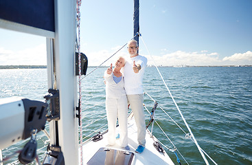 Image showing senior couple hugging on sail boat or yacht in sea