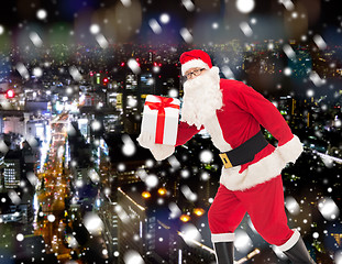 Image showing man in costume of santa claus with gift box