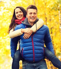 Image showing smiling friends having fun in autumn park