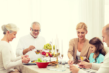 Image showing smiling family having holiday dinner at home