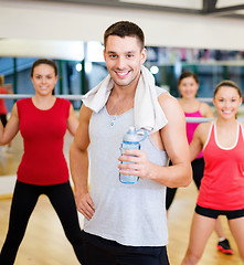 Image showing smiling trainer in front of group of people