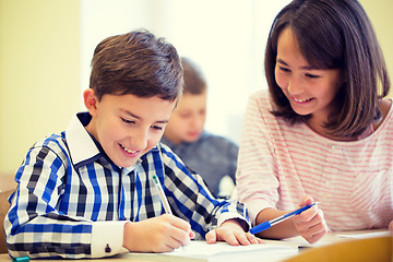 Image showing group of school kids writing test in classroom