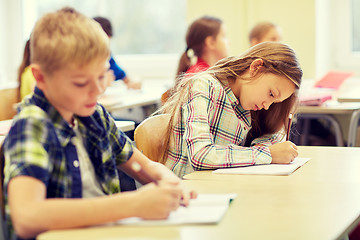 Image showing group of school kids writing test in classroom