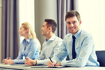 Image showing group of smiling businesspeople meeting in office