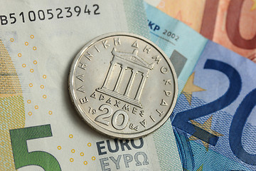 Image showing Drachma coin on euro note