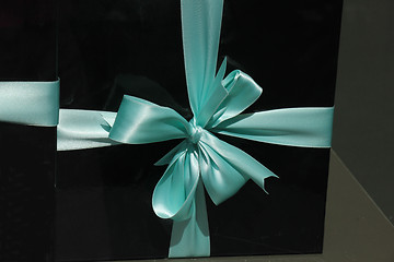 Image showing Gift box with blue ribbon