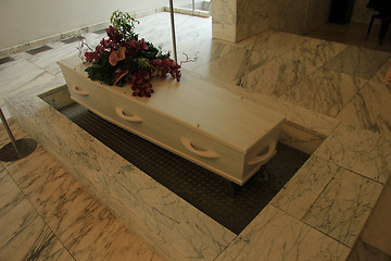 Image showing White casket with funeral flowers