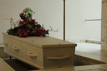 Image showing White casket with funeral flowers