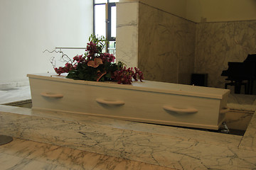 Image showing Coffin with funeral flowers