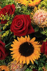 Image showing Sunflowers and roses