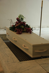 Image showing Coffin with funeral flowers