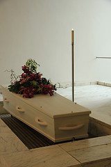 Image showing Funeral flowers on a casket