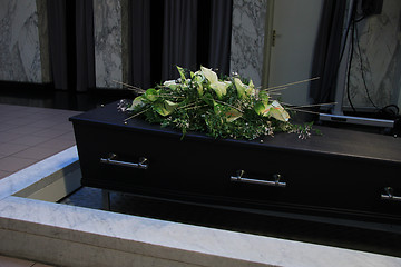 Image showing Funeral flowers on a casket