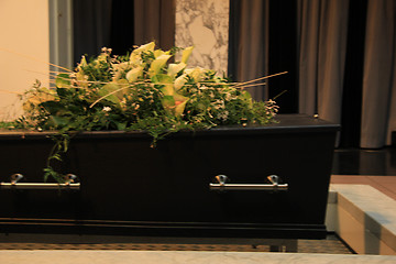 Image showing Coffin with funeral flowers