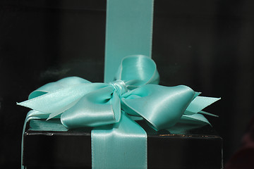 Image showing Gift box with blue ribbon