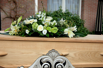 Image showing Funeral flowers on a casket