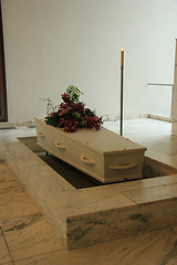 Image showing Funeral flowers on a casket