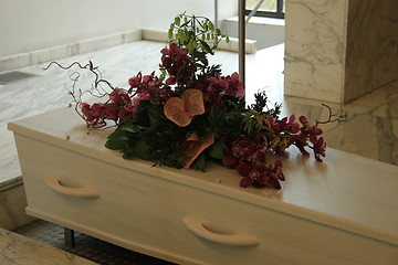 Image showing Funeral flowers on a casket