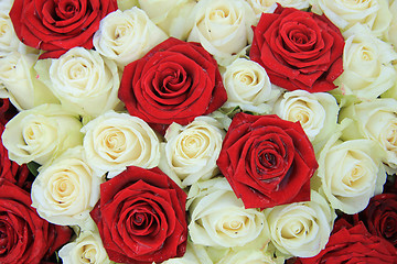 Image showing Red and white roses in a wedding arrangement