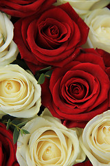 Image showing Red and white roses in a wedding arrangement