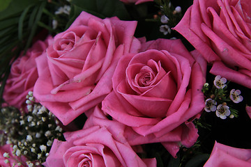 Image showing Big pink roses in a bridal bouquet