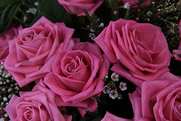 Image showing Big pink roses in a bridal bouquet