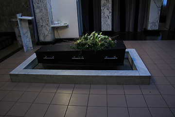 Image showing Coffin with funeral flowers