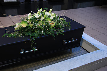 Image showing Funeral flowers on a casket