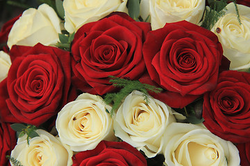 Image showing Red and white roses in a wedding arrangement