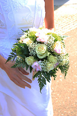 Image showing Bride holding bouquet