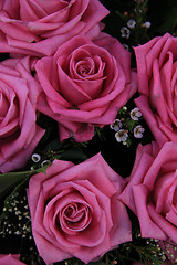 Image showing Big pink roses in a bridal bouquet