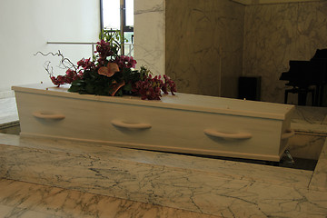 Image showing Funeral flowers on a casket