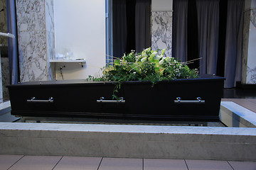 Image showing Coffin with funeral flowers