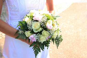 Image showing Bride holding bouquet