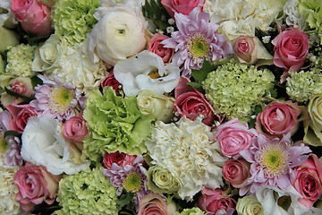 Image showing Pink, green and white bridal arrangement