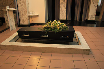 Image showing Coffin with funeral flowers