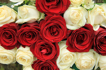 Image showing Red and white roses in a wedding arrangement