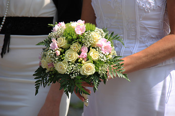 Image showing Bride holding bouquet