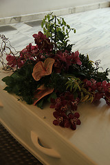 Image showing Funeral flowers on a casket