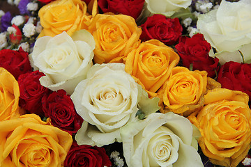 Image showing yellow, white and red roses in a wedding arrangement