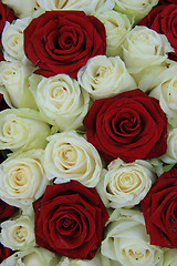 Image showing Red and white roses in a wedding arrangement