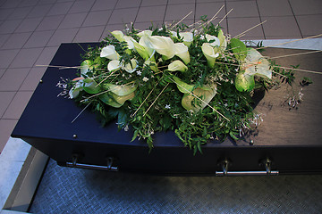 Image showing Coffin with funeral flowers