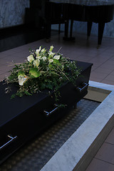 Image showing Coffin with funeral flowers