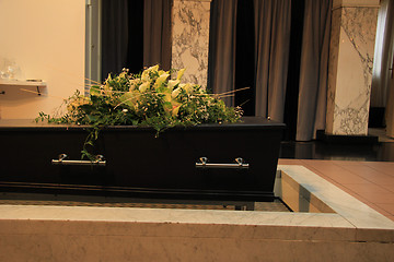 Image showing Funeral flowers on a casket