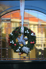 Image showing Classic christmas wreath with decorations on a door