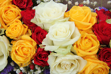 Image showing yellow, white and red roses in a wedding arrangement