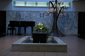 Image showing Coffin with funeral flowers