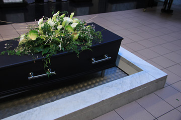 Image showing Coffin with funeral flowers