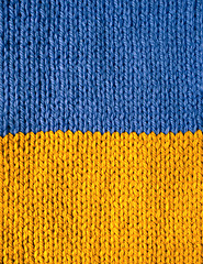 Image showing Stockinette stitch knitting in blue and yellow yarn
