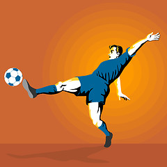 Image showing Soccer player kicking the ball